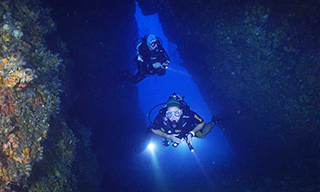 A couple of divers enjoying a cave in Myanmar