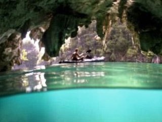 Kayaking past a cave mouth near Misool in the Raja Ampat - photo courtesy of Ethan Daniels